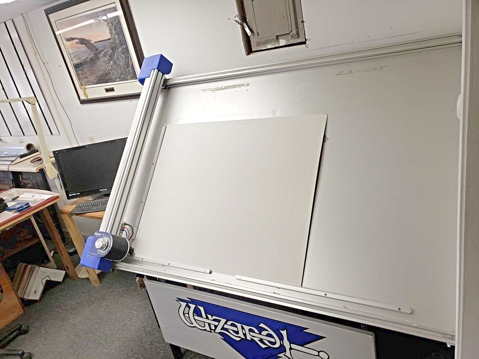 Picture Framing Equipment Lot: Wizard 8000 CMC Mat Cutter, Morso Chopper, Frame Square Saw, Fletcher 3000 60″ Multi Material Cutter, Fletcher 2100 60″ Mat Cutter Cutter, Cassese Pneumatic Joiner, Electric Miter Sander, Shrink Wrap Machine, Assorted Supplies, & Assorted Rack (Used) Item # UE-111320C (Iowa)