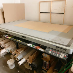 Equipment Lot: Potdevin NTZ36 36" Cold Gluer w/ Stand, Potdevin W36 36" Rotary Press, Tensador II T-125 48" Canvas Stretcher, Drytac HGP 360 Hot Vacuum Press, Gluefast 32" Colonel Hot / Cold Gluer, Fredrix Stretch Aire Canvas Stretching Machine, Camera Photo Box Photography System, Portable Banding Machine, Fletcher Turbo Saber 250-AT Sawtooth Insertion Machine, Universal DY-AW180 Double Miter Saw, Vacuseal 5298H Vacuum Dry Mount Press, Frame Moulding Samples Display Panels System, Picture Framing Press Mounting Tissue & Release Paper (Used) Item # UE-091321A (North Carolina)